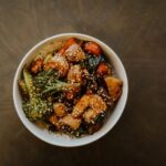 A great stir-fry is more than a combination of vegetables, protein, and noodles or rice—it’s the sauce that ties everything together. While grocery store shelves are filled with bottled options, making your own sauce at home gives you complete control over flavor, sweetness, saltiness, and spice. Better yet, you probably already have most of the ingredients sitting in your pantry. Learning how to create a homemade stir-fry sauce doesn't require professional cooking skills or a long list of specialty ingredients. By understanding a few basic flavor principles, you can mix and match everyday staples to create sauces that complement everything from chicken and beef to tofu and fresh vegetables. Once you know the fundamentals, you'll rarely need to rely on store-bought alternatives again. Why Homemade Sauces Are Worth the Effort Preparing your own sauce allows you to customize every aspect of the recipe. If you prefer a sweeter finish, you can add a little extra honey or brown sugar. If you enjoy bold, savory flavors, you can increase the soy sauce or garlic. You can even adjust the thickness to suit whether you're serving the meal over rice, noodles, or vegetables. Another advantage is freshness. Homemade sauces often contain fewer preservatives and unnecessary additives than many bottled varieties. They're also an excellent way to use pantry ingredients you already keep on hand, making weeknight meals both affordable and convenient. With just a few staple ingredients, you can prepare a flavorful stir fry sauce that works with countless recipes, eliminating the guesswork whenever you're craving a quick homemade dinner. The Five Essential Flavor Components Most successful stir-fry sauces are built by balancing five key elements. Understanding these building blocks makes it much easier to experiment confidently. 1. Salty The salty component creates the foundation of the sauce. Common choices include: Soy sauce Low-sodium soy sauce Tamari Coconut aminos These ingredients provide depth while enhancing the natural flavors of the food. 2. Sweet A touch of sweetness balances salty and savory flavors. Popular options include: Honey Brown sugar Maple syrup White sugar Only a small amount is usually needed to create a well-rounded sauce. 3. Acid Acidity brightens the overall flavor and prevents the sauce from tasting heavy. Good pantry choices include: Rice vinegar Apple cider vinegar Fresh lemon juice Fresh lime juice Even a teaspoon or two can make a noticeable difference. 4. Aromatics Garlic and ginger are classic additions that add warmth and complexity. Fresh ingredients often provide the strongest flavor, but garlic powder and ground ginger can work well when you're short on time. Other flavorful additions include: Onion powder Shallots Scallions Sesame oil 5. Thickener A quality stir-fry sauce lightly coats the ingredients rather than pooling at the bottom of the pan. Cornstarch mixed with cold water creates a simple slurry that thickens the sauce during cooking. Arrowroot powder is another excellent alternative. A Simple Homemade Stir-Fry Sauce Recipe Once you understand the basic flavor balance, creating your own sauce becomes incredibly simple. Ingredients ¼ cup low-sodium soy sauce 2 tablespoons honey 1 tablespoon rice vinegar 2 cloves garlic, minced 1 teaspoon grated fresh ginger 1 teaspoon sesame oil 1 tablespoon cornstarch 2 tablespoons cold water Instructions Whisk together the soy sauce, honey, rice vinegar, garlic, ginger, and sesame oil. In a separate small bowl, combine the cornstarch and cold water until smooth. Stir the slurry into the sauce mixture. Pour the sauce into a hot skillet or wok during the final few minutes of cooking your vegetables and protein. Stir continuously until the sauce thickens and evenly coats the ingredients. The result is a balanced sauce that works beautifully with chicken, beef, shrimp, tofu, or mixed vegetables. Easy Ways to Customize the Flavor One of the biggest advantages of homemade sauces is their flexibility. For More Heat Add one or more of the following: Sriracha Chili garlic sauce Crushed red pepper flakes Fresh sliced chilies For Extra Sweetness Try: Additional honey Brown sugar Pineapple juice Orange juice For More Umami Boost savory flavor with: Oyster sauce Mushroom powder Hoisin sauce Worcestershire sauce For Nutty Flavor A small amount of toasted sesame oil or natural peanut butter adds richness without overwhelming the dish. Pantry Staples Worth Keeping Stocking a few versatile ingredients makes homemade stir-fry meals much easier. Consider keeping: Soy sauce Rice vinegar Sesame oil Cornstarch Honey Brown sugar Garlic Ginger Black pepper Red pepper flakes With these basics available, you'll always have the foundation for a delicious homemade sauce. Common Mistakes to Avoid Even simple sauces can be improved by avoiding a few common errors. Adding Too Much Soy Sauce Excess soy sauce can quickly overpower the dish. Taste as you go and adjust gradually. Forgetting the Thickener Without cornstarch or another thickener, the sauce may remain watery instead of clinging to the ingredients. Using High Heat Too Early Cooking garlic over excessively high heat may cause it to burn and develop bitterness. Skipping the Taste Test Before adding the sauce to your stir-fry, taste it. Small adjustments are much easier before cooking than afterward. Best Foods to Pair with Homemade Stir-Fry Sauce A versatile homemade sauce works with a wide variety of ingredients. Popular proteins include: Chicken breast Beef strips Shrimp Pork Tofu Favorite vegetables include: Broccoli Bell peppers Snap peas Mushrooms Carrots Bok choy Zucchini Complete the meal with steamed jasmine rice, brown rice, rice noodles, or lo mein noodles for a satisfying dinner. Make-Ahead Tips Homemade stir-fry sauce is ideal for meal preparation. Mix the ingredients in advance and store the sauce in an airtight jar in the refrigerator for up to one week. Shake well before using, as the cornstarch may settle over time. Preparing the sauce ahead of time allows you to create fresh stir-fry dinners in just minutes, making busy weeknights much less stressful. Final Thoughts Learning how to build the perfect stir-fry sauce from everyday pantry ingredients is one of the most useful kitchen skills you can develop. Rather than relying on bottled sauces, you can create fresh, customizable flavors that perfectly match your personal preferences and the ingredients you have on hand. By understanding the balance of salty, sweet, acidic, aromatic, and thickening elements, you'll be able to create countless variations without following a recipe every time. Whether you're preparing a quick vegetable stir-fry, a hearty chicken dinner, or a flavorful noodle bowl, a homemade sauce adds freshness and depth that transforms simple ingredients into a meal you'll want to make again and again.
