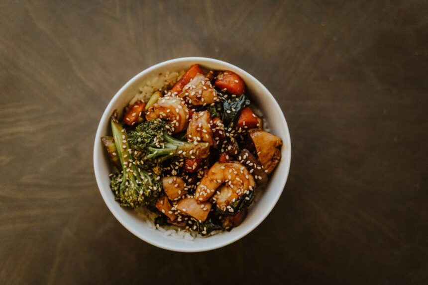 A great stir-fry is more than a combination of vegetables, protein, and noodles or rice—it’s the sauce that ties everything together. While grocery store shelves are filled with bottled options, making your own sauce at home gives you complete control over flavor, sweetness, saltiness, and spice. Better yet, you probably already have most of the ingredients sitting in your pantry. Learning how to create a homemade stir-fry sauce doesn't require professional cooking skills or a long list of specialty ingredients. By understanding a few basic flavor principles, you can mix and match everyday staples to create sauces that complement everything from chicken and beef to tofu and fresh vegetables. Once you know the fundamentals, you'll rarely need to rely on store-bought alternatives again. Why Homemade Sauces Are Worth the Effort Preparing your own sauce allows you to customize every aspect of the recipe. If you prefer a sweeter finish, you can add a little extra honey or brown sugar. If you enjoy bold, savory flavors, you can increase the soy sauce or garlic. You can even adjust the thickness to suit whether you're serving the meal over rice, noodles, or vegetables. Another advantage is freshness. Homemade sauces often contain fewer preservatives and unnecessary additives than many bottled varieties. They're also an excellent way to use pantry ingredients you already keep on hand, making weeknight meals both affordable and convenient. With just a few staple ingredients, you can prepare a flavorful stir fry sauce that works with countless recipes, eliminating the guesswork whenever you're craving a quick homemade dinner. The Five Essential Flavor Components Most successful stir-fry sauces are built by balancing five key elements. Understanding these building blocks makes it much easier to experiment confidently. 1. Salty The salty component creates the foundation of the sauce. Common choices include: Soy sauce Low-sodium soy sauce Tamari Coconut aminos These ingredients provide depth while enhancing the natural flavors of the food. 2. Sweet A touch of sweetness balances salty and savory flavors. Popular options include: Honey Brown sugar Maple syrup White sugar Only a small amount is usually needed to create a well-rounded sauce. 3. Acid Acidity brightens the overall flavor and prevents the sauce from tasting heavy. Good pantry choices include: Rice vinegar Apple cider vinegar Fresh lemon juice Fresh lime juice Even a teaspoon or two can make a noticeable difference. 4. Aromatics Garlic and ginger are classic additions that add warmth and complexity. Fresh ingredients often provide the strongest flavor, but garlic powder and ground ginger can work well when you're short on time. Other flavorful additions include: Onion powder Shallots Scallions Sesame oil 5. Thickener A quality stir-fry sauce lightly coats the ingredients rather than pooling at the bottom of the pan. Cornstarch mixed with cold water creates a simple slurry that thickens the sauce during cooking. Arrowroot powder is another excellent alternative. A Simple Homemade Stir-Fry Sauce Recipe Once you understand the basic flavor balance, creating your own sauce becomes incredibly simple. Ingredients ¼ cup low-sodium soy sauce 2 tablespoons honey 1 tablespoon rice vinegar 2 cloves garlic, minced 1 teaspoon grated fresh ginger 1 teaspoon sesame oil 1 tablespoon cornstarch 2 tablespoons cold water Instructions Whisk together the soy sauce, honey, rice vinegar, garlic, ginger, and sesame oil. In a separate small bowl, combine the cornstarch and cold water until smooth. Stir the slurry into the sauce mixture. Pour the sauce into a hot skillet or wok during the final few minutes of cooking your vegetables and protein. Stir continuously until the sauce thickens and evenly coats the ingredients. The result is a balanced sauce that works beautifully with chicken, beef, shrimp, tofu, or mixed vegetables. Easy Ways to Customize the Flavor One of the biggest advantages of homemade sauces is their flexibility. For More Heat Add one or more of the following: Sriracha Chili garlic sauce Crushed red pepper flakes Fresh sliced chilies For Extra Sweetness Try: Additional honey Brown sugar Pineapple juice Orange juice For More Umami Boost savory flavor with: Oyster sauce Mushroom powder Hoisin sauce Worcestershire sauce For Nutty Flavor A small amount of toasted sesame oil or natural peanut butter adds richness without overwhelming the dish. Pantry Staples Worth Keeping Stocking a few versatile ingredients makes homemade stir-fry meals much easier. Consider keeping: Soy sauce Rice vinegar Sesame oil Cornstarch Honey Brown sugar Garlic Ginger Black pepper Red pepper flakes With these basics available, you'll always have the foundation for a delicious homemade sauce. Common Mistakes to Avoid Even simple sauces can be improved by avoiding a few common errors. Adding Too Much Soy Sauce Excess soy sauce can quickly overpower the dish. Taste as you go and adjust gradually. Forgetting the Thickener Without cornstarch or another thickener, the sauce may remain watery instead of clinging to the ingredients. Using High Heat Too Early Cooking garlic over excessively high heat may cause it to burn and develop bitterness. Skipping the Taste Test Before adding the sauce to your stir-fry, taste it. Small adjustments are much easier before cooking than afterward. Best Foods to Pair with Homemade Stir-Fry Sauce A versatile homemade sauce works with a wide variety of ingredients. Popular proteins include: Chicken breast Beef strips Shrimp Pork Tofu Favorite vegetables include: Broccoli Bell peppers Snap peas Mushrooms Carrots Bok choy Zucchini Complete the meal with steamed jasmine rice, brown rice, rice noodles, or lo mein noodles for a satisfying dinner. Make-Ahead Tips Homemade stir-fry sauce is ideal for meal preparation. Mix the ingredients in advance and store the sauce in an airtight jar in the refrigerator for up to one week. Shake well before using, as the cornstarch may settle over time. Preparing the sauce ahead of time allows you to create fresh stir-fry dinners in just minutes, making busy weeknights much less stressful. Final Thoughts Learning how to build the perfect stir-fry sauce from everyday pantry ingredients is one of the most useful kitchen skills you can develop. Rather than relying on bottled sauces, you can create fresh, customizable flavors that perfectly match your personal preferences and the ingredients you have on hand. By understanding the balance of salty, sweet, acidic, aromatic, and thickening elements, you'll be able to create countless variations without following a recipe every time. Whether you're preparing a quick vegetable stir-fry, a hearty chicken dinner, or a flavorful noodle bowl, a homemade sauce adds freshness and depth that transforms simple ingredients into a meal you'll want to make again and again.